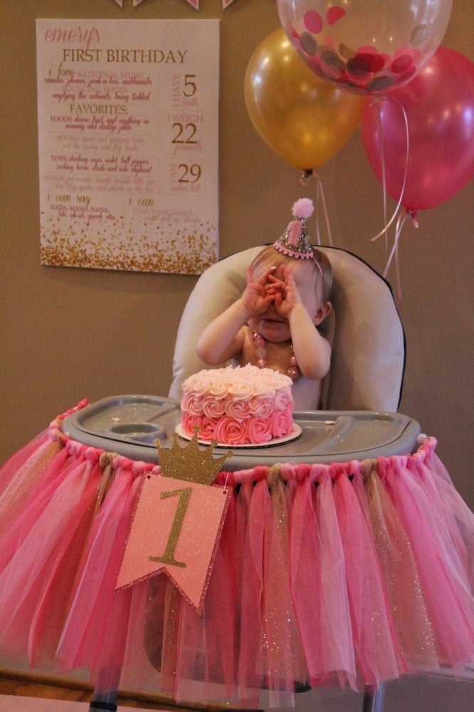 Pink and gold high chair idea for a first birthday party. 