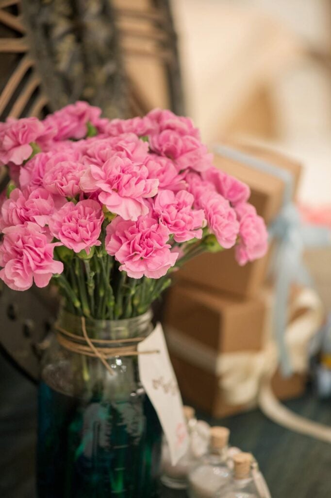 Beautiful pink flowers in a vase for this Cinderella 4th birthday party