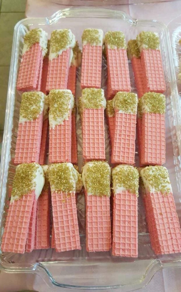 Pink and gold wafers as birthday party snacks.
