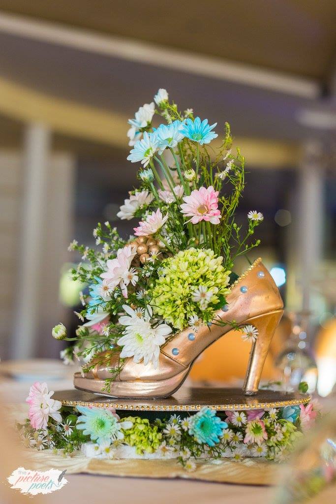 Gold heel and flower centerpiece