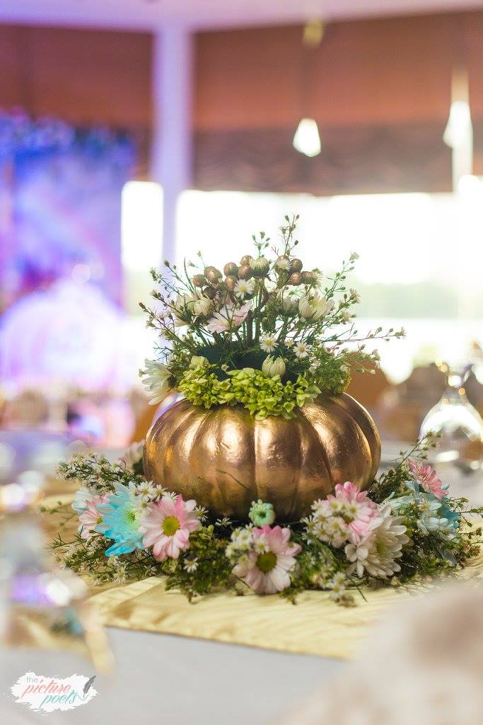 Gold pumpkin flower centerpiece