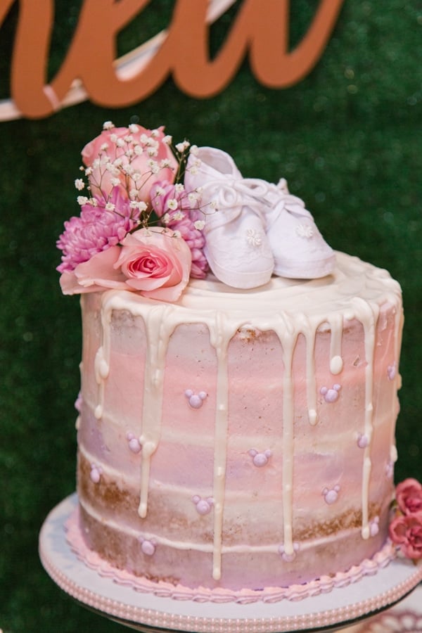 Pink Baby Shower Cake with flowers and baby shoes