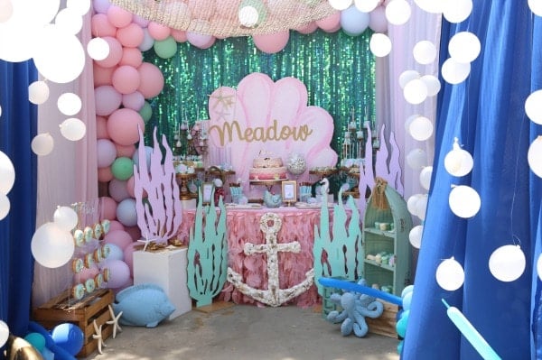Mermaid birthday party dessert table and decorations