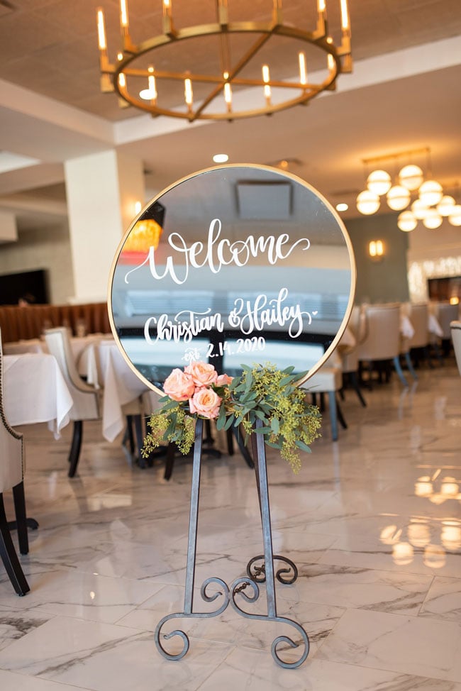 Circle Mirror Welcome Sign With Flower Decor