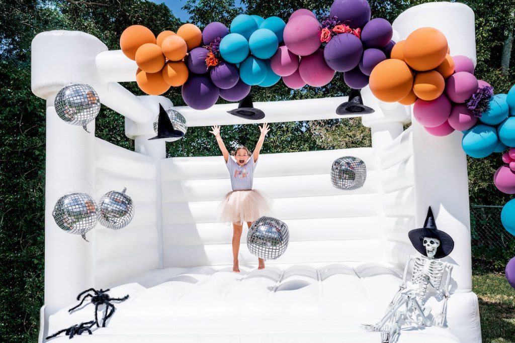 Girl jumping in a bounce house