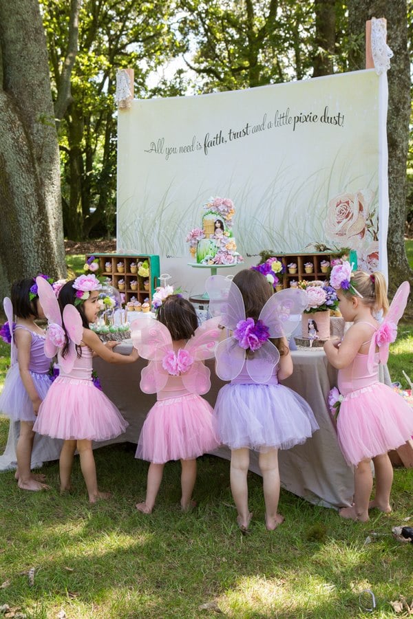 Pink and purple tutus and fairy wings for a little girl's fairy-themed birthday party