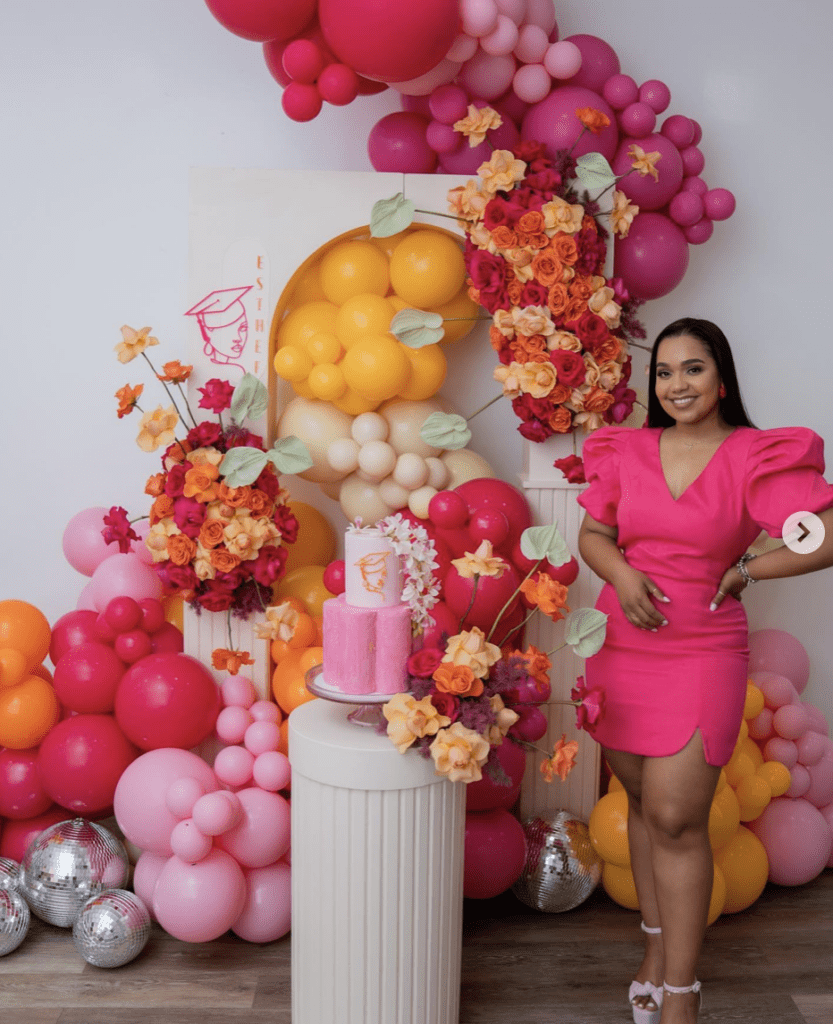 Pink, orange, and cream graduation party decor