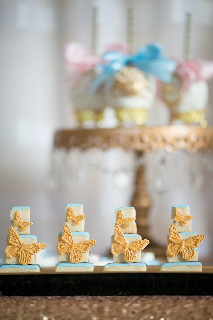 Stacked butterfly cookies for a Cinderella-themed party